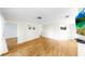 Spacious living room features wood-look floors and neutral paint at 4851 Leyte Ct, New Port Richey, FL 34655