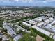 A beautiful aerial view showcasing the community's layout, trees, and nearby church at 5810 21St N St # 10, St Petersburg, FL 33714