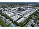 The overhead view showcases ponds, tennis courts, landscaping, and parking around the community at 5810 21St N St # 10, St Petersburg, FL 33714
