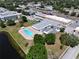 Aerial view shows pool, lake and community buildings surrounded by beautiful landscaping at 5810 21St N St # 10, St Petersburg, FL 33714