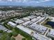 The aerial view shows multi-unit buildings, green landscaping, and parking areas at 5810 21St N St # 10, St Petersburg, FL 33714