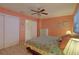 Inviting bedroom featuring a floral patterned bed and ample closet space at 5810 21St N St # 10, St Petersburg, FL 33714