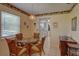 Bright dining area with a glass table, wicker chairs, and natural light at 5810 21St N St # 10, St Petersburg, FL 33714