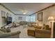 Spacious living room featuring neutral tones, two couches, and a flatscreen TV at 5810 21St N St # 10, St Petersburg, FL 33714