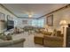 Inviting living room featuring neutral tones, two couches, and a flatscreen TV at 5810 21St N St # 10, St Petersburg, FL 33714