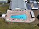 Aerial view of the community pool area with lounge chairs and tables for residents at 5810 21St N St # 10, St Petersburg, FL 33714