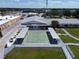 An aerial view showcases a shuffleboard court with shaded benches and surrounding landscaping at 5810 21St N St # 10, St Petersburg, FL 33714