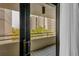 Condo balcony showcasing a view of the community with tiled flooring, accessible through a sliding glass door at 5940 Pelican Bay S Plz # 504, Gulfport, FL 33707