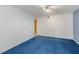 This bedroom has bright white walls and blue carpeting at 5940 Pelican Bay S Plz # 504, Gulfport, FL 33707
