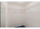 Walk-in closet featuring metal shelving, ample storage, and carpeted flooring at 5940 Pelican Bay S Plz # 504, Gulfport, FL 33707