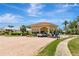 Community entrance with a covered portico, featuring a brick paved driveway at 5940 Pelican Bay S Plz # 504, Gulfport, FL 33707