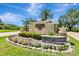 Landscaped entrance sign for Pasadena Yacht & Country Club with colorful flowers at 5940 Pelican Bay S Plz # 504, Gulfport, FL 33707