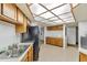 Kitchen with wood cabinets, tile floors and lots of counter space at 5940 Pelican Bay S Plz # 504, Gulfport, FL 33707