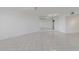 An empty living room with a large mirror wall at 5940 Pelican Bay S Plz # 504, Gulfport, FL 33707