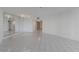 A spacious living room with a large mirror at 5940 Pelican Bay S Plz # 504, Gulfport, FL 33707