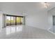 A spacious living room with natural light and balcony at 5940 Pelican Bay S Plz # 504, Gulfport, FL 33707