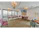 Community room with chandelier lighting, large windows and ample seating at 5940 Pelican Bay S Plz # 504, Gulfport, FL 33707