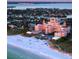 Aerial view of the Don CeSar Hotel at sunset with beach and waterfront at 600 Boca Ciega Isle Dr, St Pete Beach, FL 33706