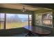 Sunroom with large windows offering tranquil views, perfect for dining and relaxation at 600 Boca Ciega Isle Dr, St Pete Beach, FL 33706