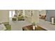 Comfortable living room area with neutral carpet, a breakfast bar and patio doors at 6035 19Th Ne St, St Petersburg, FL 33703