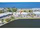 Aerial view of waterfront condos with parking, grassy area and waterfront at 611 Destiny Dr # 205, Ruskin, FL 33570