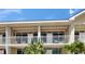 Exterior view of condo units with waterfront balconies offering outdoor seating at 611 Destiny Dr # 205, Ruskin, FL 33570
