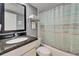 Bathroom with a granite countertop vanity and bathtub with a stylish shower curtain at 611 Destiny Dr # 205, Ruskin, FL 33570
