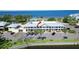 Exterior view of waterfront condos with parking, balconies, and landscaping at 611 Destiny Dr # 205, Ruskin, FL 33570