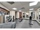 Fully equipped fitness center with weights, benches, and mirrors for a complete workout experience at 611 Destiny Dr # 205, Ruskin, FL 33570