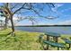 Picturesque waterfront park with picnic tables, lush greenery, and serene water views at 611 Destiny Dr # 205, Ruskin, FL 33570
