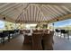 Covered outdoor patio with dining and bar seating, perfect for enjoying the scenic water view at 611 Destiny Dr # 205, Ruskin, FL 33570