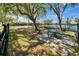 Inviting picnic area with table and benches under mature trees near the tennis court at 611 Destiny Dr # 205, Ruskin, FL 33570