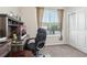 A well-lit office space with a modern desk, comfortable chair, and bright window at 6374 Bradford Woods Dr, Zephyrhills, FL 33542