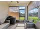 Relaxing outdoor patio with comfortable seating, privacy screens, and views of backyard at 6374 Bradford Woods Dr, Zephyrhills, FL 33542