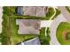 A property with lush green landscaping, well-maintained lawn, and a large driveway at 6611 Current Dr, Apollo Beach, FL 33572