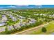 Expansive aerial view of a home in a lush neighborhood, showcasing its prime location and landscaping at 6611 Current Dr, Apollo Beach, FL 33572