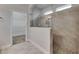 Beautiful bathroom featuring a tiled shower with glass enclosure and access to closet at 6611 Current Dr, Apollo Beach, FL 33572