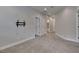 Spacious bedroom boasts neutral walls, soft carpet, and a wall-mounted television bracket at 6611 Current Dr, Apollo Beach, FL 33572