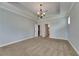 Spacious bedroom with tray ceiling, modern lighting, and ensuite bathroom at 6611 Current Dr, Apollo Beach, FL 33572