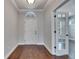 Bright entryway featuring hardwood floors and a glass paneled door at 6611 Current Dr, Apollo Beach, FL 33572