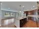 Open concept kitchen with island and stainless steel appliances at 6611 Current Dr, Apollo Beach, FL 33572