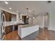 Modern kitchen featuring stainless steel appliances, granite countertops, and island at 6611 Current Dr, Apollo Beach, FL 33572
