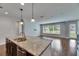 Modern kitchen featuring granite countertops, stainless steel appliances, and an open layout at 6611 Current Dr, Apollo Beach, FL 33572