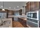 Well-equipped kitchen with modern stainless steel appliances and ample cabinet space at 6611 Current Dr, Apollo Beach, FL 33572