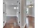 Open-concept living room featuring hardwood floors and a view of a dining area at 6611 Current Dr, Apollo Beach, FL 33572