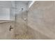 Modern bathroom shower with beige tile and pebble floor, plus brushed nickel fixtures at 6611 Current Dr, Apollo Beach, FL 33572