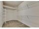 Spacious walk-in closet with carpet and wire shelving for optimal storage and organization at 6611 Current Dr, Apollo Beach, FL 33572