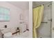Bathroom featuring a shower, vanity, toilet, and window for natural light at 711 6Th Ne St, Largo, FL 33770