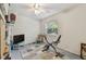 Bedroom featuring bright natural light, tiled flooring, and a ceiling fan at 711 6Th Ne St, Largo, FL 33770