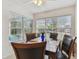 Bright dining area with large windows, creating a welcoming atmosphere for meals at 711 6Th Ne St, Largo, FL 33770